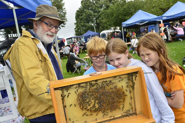 Beekeeper Bob Foy with Mary Malone, Conor and Ellen Costello.
