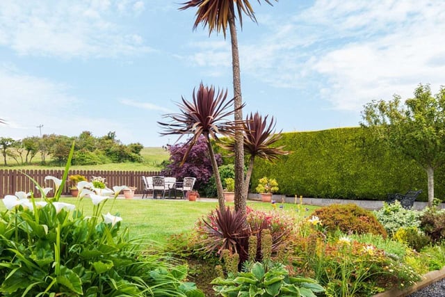 To the exterior is a delightful rear garden in lawns with well-stocked flower beds, trees and shrubs and a paved sun patio.