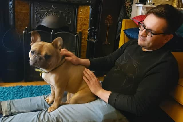 Adam with one of the foster dogs.