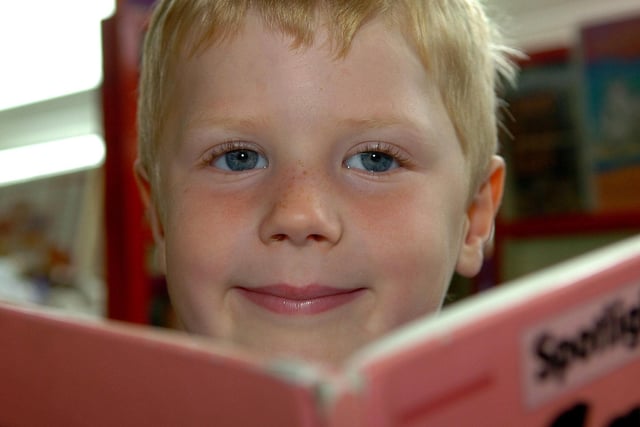 Joshua enjoys reading time on his first day at Bellaghy Primary School in 2007.