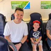 Alfie Kelly 3, with his parents Andrew and Nicole pictured at Translink’s Zero Emission bus preview at The Diamond, Coleraine Town Hall. Photo: Lorcan Doherty