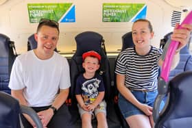 Alfie Kelly 3, with his parents Andrew and Nicole pictured at Translink’s Zero Emission bus preview at The Diamond, Coleraine Town Hall. Photo: Lorcan Doherty