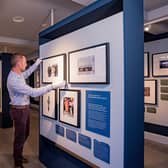Castle and Collections Manager, David Orr, puts the finishing touches to Hillsborough Castle’s first ever exhibition, Life Through A Royal Lens
