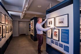 Castle and Collections Manager, David Orr, puts the finishing touches to Hillsborough Castle’s first ever exhibition, Life Through A Royal Lens