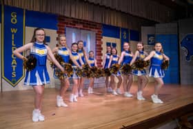 Cheerleaders ready for the show to begin.