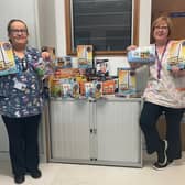 Ulster Hospital Health Play Specialist’s Sharon Pauley and Gillian Sinclair with the Fairy Bricks Lego donations. Pic credit: SEHSCT