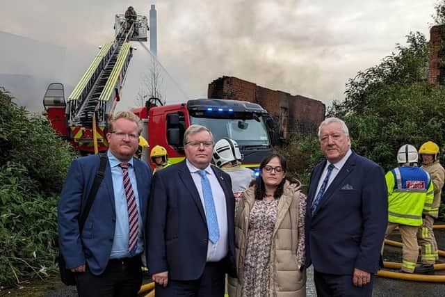Local councillors Gary Hynds, Jonathan Craig, Nicola Parker, and Pat Catney at the scene of the fire at Hilden Mill. Pic credit: LDR