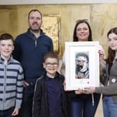 Farragh McGeary (age 13) from St. Patrick's Academy, Dungannon, is a winner in this year's 69th Texaco Children's Art Competition. She is pictured with her prize-winning work entitled ‘Don’t Tell Mom’ with her brother Dáithí (11), father Brian, brother Emmet (6) and mother Eimear.The picture was taken at a function to announce the top winners held in Dublin.