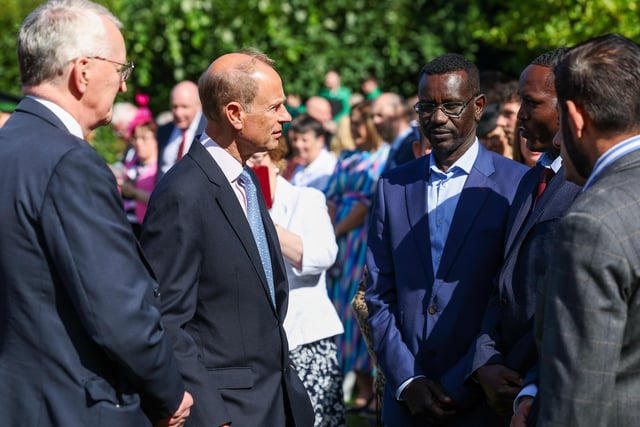 The Duke of Edinburgh, Prince Edward, meets business owners who recently had their businesses attacked during riots in Belfast.