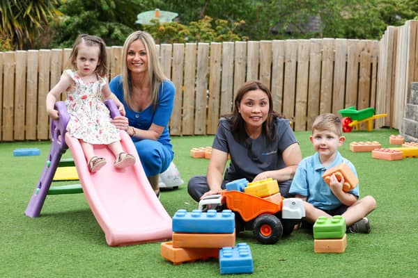 Celebrating Clear Day Nurseries’ prestigious UK industry awards for its childcare facilities are Sienna McLoughlin (2) and mum Nicole, Evelyn Verschuur, pre-school room leader and Daire O’Connor (4), at Kids@BT9 Daycare in Belfast. Credit: Matt Mackey