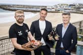 Peter Rainey with Top Blade directors, Aaron Taggart (centre) and John Crawford (right) announcing the launch of the brand's newest venue in Portrush. Photo: submitted