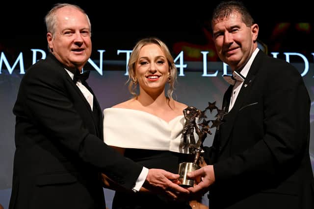 16 November 2024; Aoife McCoy of Armagh is presented with her All-Star award by Ard Stiúrthóir TG4 Alan Esslemont and President of the LGFA, Mícheál Naughton during the TG4 Ladies Football All Stars Awards banquet, in association with Lidl, at the Bonnington Dublin Hotel in Dublin.  Photo by Brendan Moran/Sportsfile