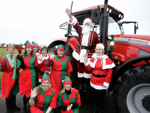 Santa arrives at Lislagan Primary school in Ballymoney with the help of a McCormick tractor in 2008,the event was organised by the PTA at the school.