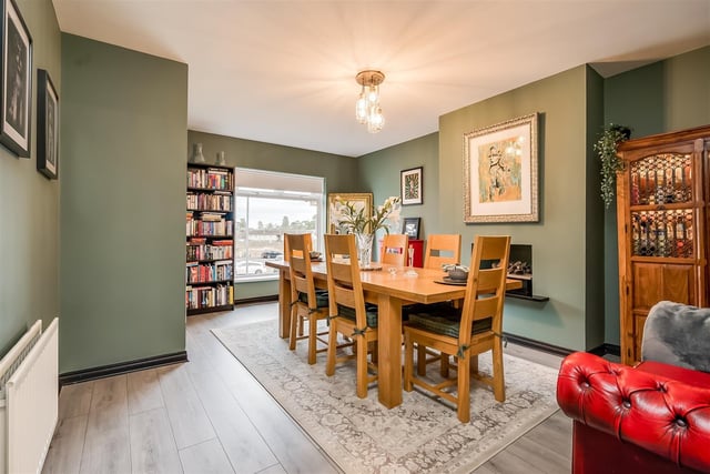 Dining room/lounge with contemporary, wall recessed fireplace.