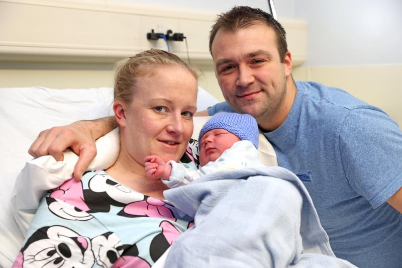 Sophie Moulds and husband Harry with their baby son Alfie, born at 43 minutes past midnight at the Royal Victoria Hospital, weighing 8lb 4oz.  Picture by Peter Morrison / PressEye