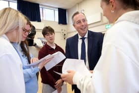 Belfast High School pupils celebrate their A-Level results at the school with Education Minister Paul Givan, August 2024. Photo: Stephen Davison/Pacemaker Press
