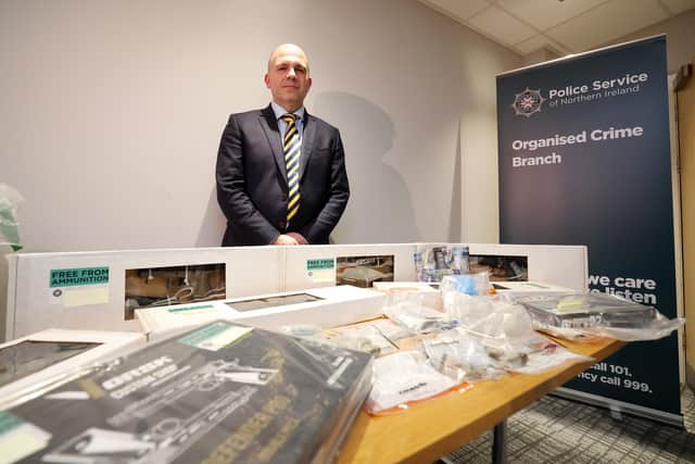 Detective Chief Inspector Richard Thornton of PSNI Organised Crime Team pictured with some of the items recovere on Monday during searches in Portadown including nine suspected firearms, which will now be subject to investigation, several Samurai swords, approximately £6,000 in cash, quantities of Class A and B controlled drugs, along with related paraphernalia. Picture: Jonathan Porter / PressEye