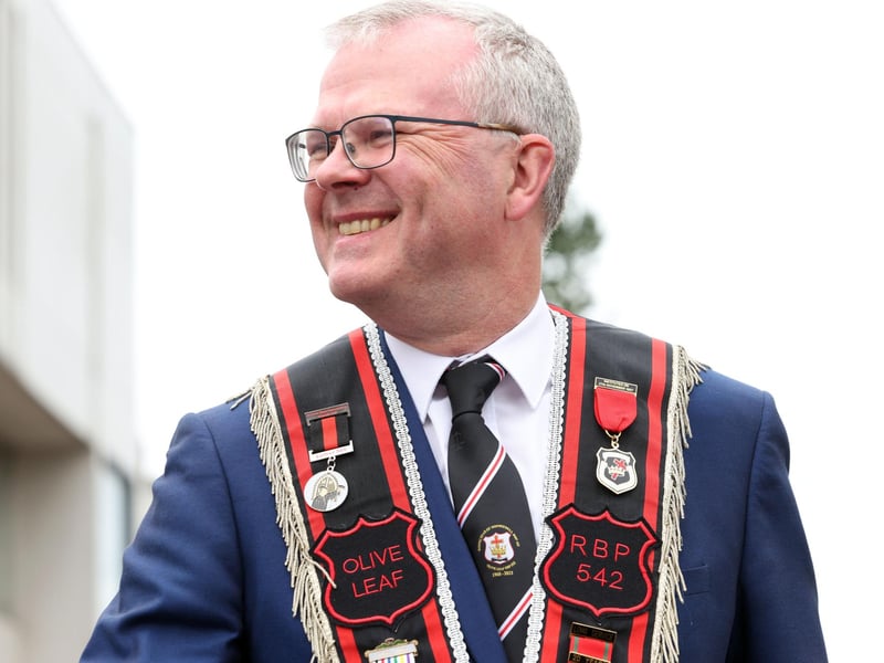 Spotting a friend during the Royal Black parade in Bangor on Saturday.