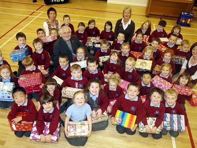 Pupils and Staff from Pond Park Primary School pictured with Shoe Boxes filled with Gifts for Operation Christmas Child A Project of Samaritan's Purse in 2007