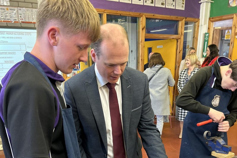 East Antrim MLA Gordon Lyons in conversation with a pupil about life at Carrickfergus Academy.