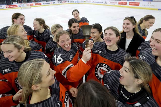The Princeton Tigers' team celebrates with The Belpot Trophy after Saturday afternoon's Friendship series win against the Providence Friars.    The Friendship Series is the first and only NCAA Division 1 women’s hockey tournament to be held outside of the United States. Photo by William Cherry/Presseye