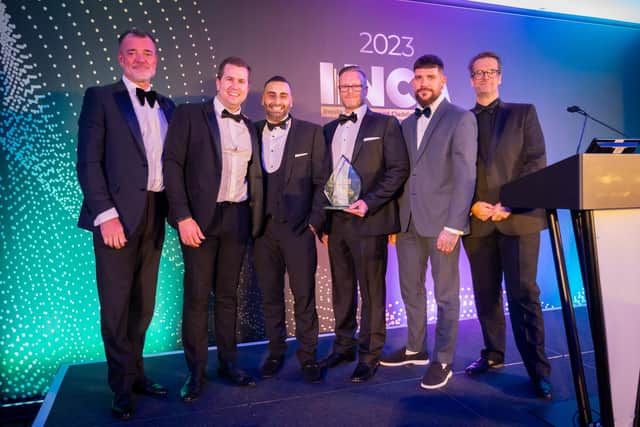 Tarvinder Katavada, EWI Sales Specification Manager and Scott Bradshaw, National EWI Specification Manager at K Systems accept the award for Mid-Rise Refurbishment Render Finish at the prestigious INCA Awards in Nottingham.  Photo: Chris Towlson