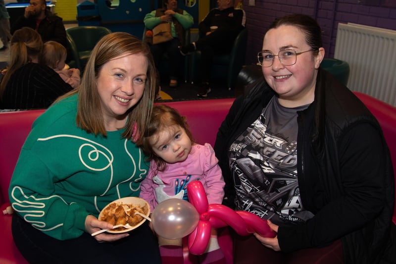 Enjoying Irish stew at the Park Road and Obins Street St Patrick's fun day are from left, Angela Lynn and daughter Clara (2) and Emma Donnelly. PT11-236.