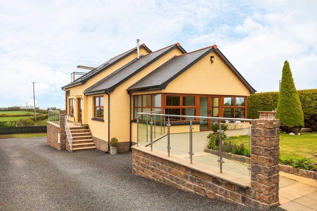 On the market for £429,950 with Hunter Campbell estate agents, this contemporary detached family home enjoys far-reaching sea views over the North Channel to the Scottish coast and the Glens of Antrim.  The interior accommodation includes an impressive 28 foot long kitchen/living room, a bright sunroom and a separate lounge with double aspect.  The first floor is given over solely to the master bedroom suite with balcony window and walk-in robe. There is an option for a further 3/4 bedrooms, including what is currently used as a large games room on the lower level. There is also a contemporary family bathroom and a separate ground floor shower room with multi-jet steam shower cabin.  Externally, there are manicured gardens providing ample parking space, as well as neat lawns with a paved sun patio and a double garage.