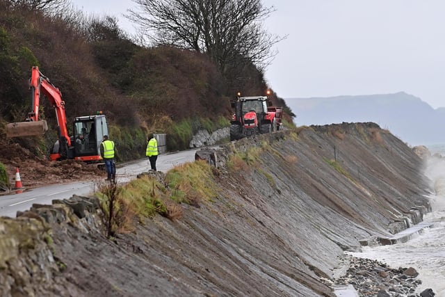 Workmen at the scene of the Coast Road landslide in Co Antrim.