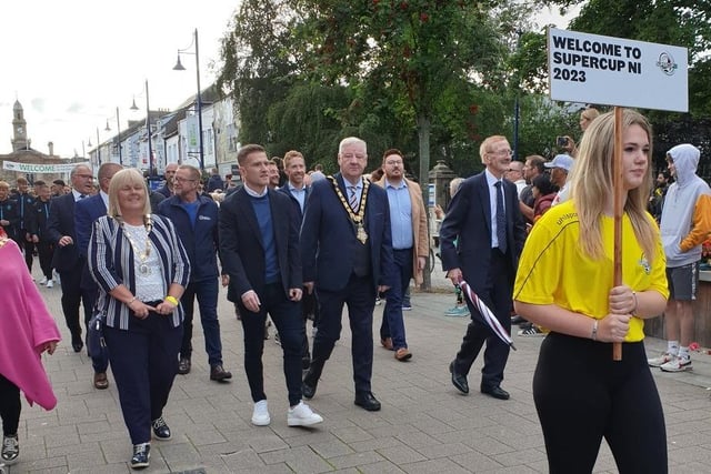 Mayor of Causeway Coast and Glens Borough Council, Councillor Steven Callaghan and Deputy Mayor of Causeway Coast and Glens Borough Council, Councillor Margaret Anne McKillop join the opening parade for this year’s Supercup NI as it makes its way through Coleraine town centre. Credit CCGB Council