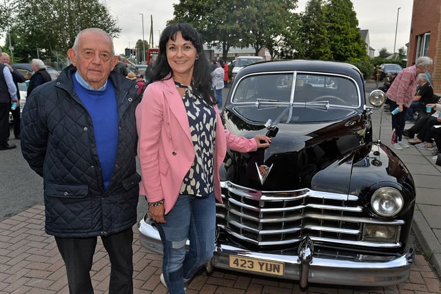 John Wilson of the Birches Vintage Vehicle Club and Cristina Citea, acting manager of Mahon Hall Care Home pictured during the vintage vehicle visit to the home on Friday evening. PT36-200.