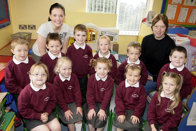 ALL SAINTS. Smiling P1 pupils from St Anne's PS Corkey, pictured in 2008 along with their Teacher, Bronagh Marron (left) and Classroom Assistant, Christine McAuley.BM39-003SC.