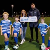 Northend United Youth FC Under-10s players William and Archie are delighted to receive the donation from Power NI on behalf of the club.