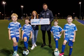 Northend United Youth FC Under-10s players William and Archie are delighted to receive the donation from Power NI on behalf of the club.