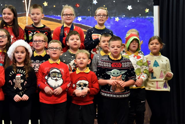 Pupils of class P4S performing their song, 'King Seekers' during the Hart Memorial Primary School Key Stage One Christmas Variety Concert. PT50-813.