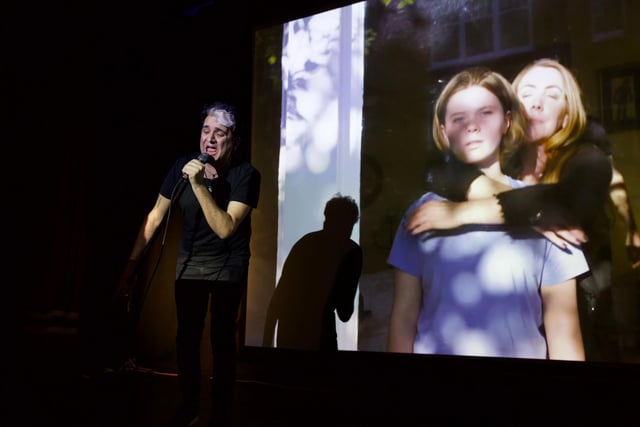 Tim Arnold sings live to film with actors Dixie McDevitt and Kate Alderton as Bella and Kathleen Curtis, on screen. Photo by Stephen Cassidy