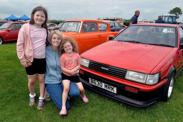 Rachel McShane and daughters, Molly (8) and Chloe (5) pictured with their vintage Toyota car at the  Birches Vintage Rally on Saturday afternoon. PT27-209. Photo by Tony Hendron