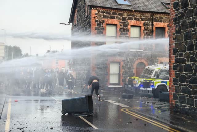 Police deploy water cannon on Tuesday evening. Photo: Pacemaker