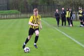 Full concentration from village player Nathan Weir.