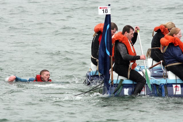HOLD ON FOR ME...This rafter tries to get back to his raft during the Spar RNLI Raft Race in Portrush in 2009