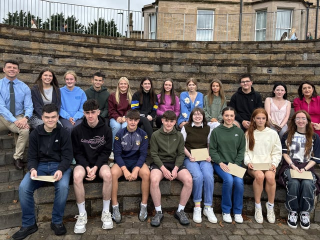 Selection of students who achieved 8 A star to A grades with Mr McCorley, head of Year 12 and Mrs O'Neill, principal.