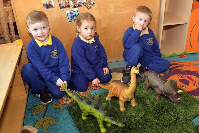 Playing with the toy dinosaurs at Edenderry Nursery School  are from left, Bradley, Emily and Theo. PT43-306.