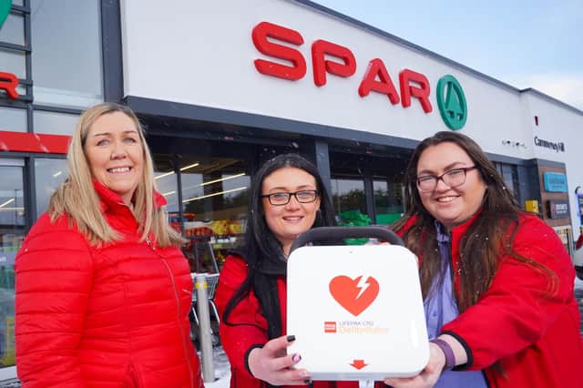 Bronagh Luke, Head of Corporate Marketing at Henderson Group with Lee McMaster, Team Leader at SPAR Carnmoney Hill and Avril O'Donnell, the store’s Assistant Manager.