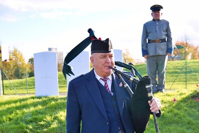 A piper played laments at the service.