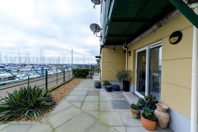 Large paved patio area with gate onto the marina coastal path and own patio door access to the apartment.