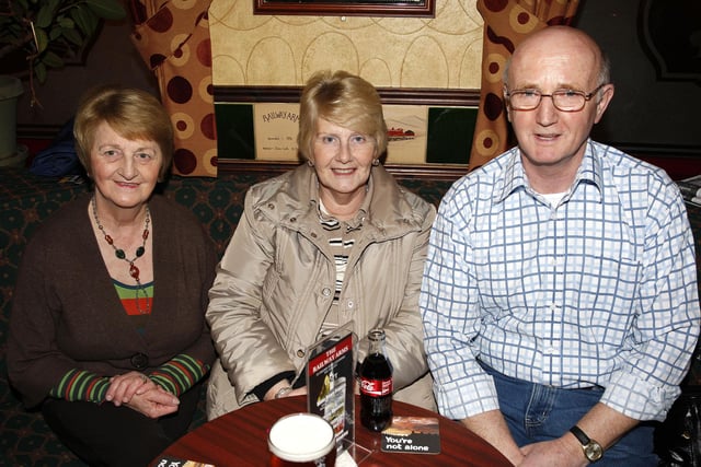 Pictured during the Macmillan Cancer Support Causeway Fundraising Group table quiz at the Railway Arms Bar, Coleraine, in 2009 are Anna White, Barbara and Bobby Baxter.