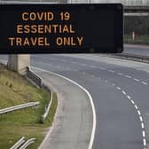 A motorway sign on the M8 advising on essential travel only (Photo: Jeff J Mitchell/Getty Images)