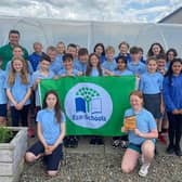 Eco-School of the Year: Portstewart Primary School with their ‘green’ prizes and Gareth Lamrock, Field Officer, Keep NI Beautiful. Credit Christopher Walsh, Keep NI Beautiful