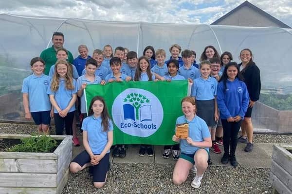 Eco-School of the Year: Portstewart Primary School with their ‘green’ prizes and Gareth Lamrock, Field Officer, Keep NI Beautiful. Credit Christopher Walsh, Keep NI Beautiful