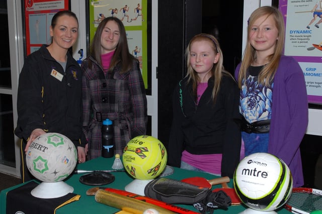 Mrs Mary Quigley, head of PE at Brownlow College and past pupil Grace Hamilton show the some of the sports to Courtney McCracken and Serena Hamilton at the open night in 2010.